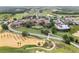 Extensive view of the community featuring a golf course and surrounding residential homes and green spaces at 16049 Volterra Pt, Bella Collina, FL 34756