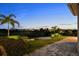 Backyard with a well-manicured lawn, providing a private outdoor oasis at 16049 Volterra Pt, Bella Collina, FL 34756