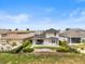 Lush backyard with a patio, complemented by mature landscaping and privacy fencing at 16049 Volterra Pt, Bella Collina, FL 34756