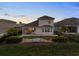 Tranquil backyard featuring a stone patio, verdant landscaping, and a privacy fence at 16049 Volterra Pt, Bella Collina, FL 34756