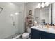 This bright bathroom features a sink, toilet, and shower with a clear glass door at 16049 Volterra Pt, Bella Collina, FL 34756