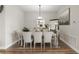 Elegant dining room features a stylish table setting and sophisticated decor at 16049 Volterra Pt, Bella Collina, FL 34756