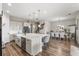 Charming dining room with stylish table and chairs and ample natural light at 16049 Volterra Pt, Bella Collina, FL 34756