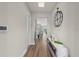 Bright hallway with hardwood floors, stylish decor, and contemporary accents creating a welcoming entrance at 16049 Volterra Pt, Bella Collina, FL 34756