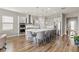 Gourmet kitchen features a large island, stainless steel appliances, and sleek countertops at 16049 Volterra Pt, Bella Collina, FL 34756