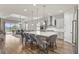 Open-concept design featuring a stylish kitchen with a center island, flowing into a comfortable living room at 16049 Volterra Pt, Bella Collina, FL 34756