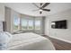 Large main bedroom suite with luxury vinyl floors and large windows with a view at 16049 Volterra Pt, Bella Collina, FL 34756