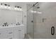 Stylish bathroom features a glass-enclosed shower and double sinks at 2211 Simmons St, Leesburg, FL 34748