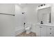 Bright bathroom features a shower-tub combination with stylish fixtures and a modern vanity at 2211 Simmons St, Leesburg, FL 34748