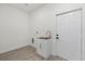Functional laundry room with utility sink and ample space at 2211 Simmons St, Leesburg, FL 34748
