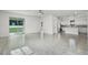 Spacious living room with open floor plan and stainless steel kitchen appliances at 2211 Simmons St, Leesburg, FL 34748
