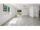 Bright living room with sliding glass doors leading to the backyard at 2211 Simmons St, Leesburg, FL 34748