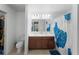 Bathroom featuring a double vanity, a tiled floor, and a shower with a curtain at 2461 Bulrush Dr, St Cloud, FL 34769