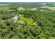 The property features ponds, green fields, and verdant forests, providing a peaceful and private setting at 2471 Jenscot Rd, St Cloud, FL 34771