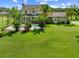 Aerial of large backyard with pool and screened in porch, showcasing the expansive lawn and outdoor living spaces at 2471 Jenscot Rd, St Cloud, FL 34771