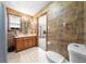 Bathroom featuring a double sink vanity, window and a view into another room at 2471 Jenscot Rd, St Cloud, FL 34771