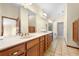 Spacious bathroom features a double vanity with lots of counter space and mirrors and a tub at 2471 Jenscot Rd, St Cloud, FL 34771