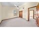 Bedroom featuring a vaulted ceiling, neutral carpeting, and an abundance of natural light from a window at 2471 Jenscot Rd, St Cloud, FL 34771