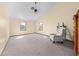 Spacious bedroom featuring neutral tones, a vaulted ceiling with fan, and natural light at 2471 Jenscot Rd, St Cloud, FL 34771