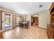 View of the dining room with tile floors, a dining table with seating, and a door leading to the exterior at 2471 Jenscot Rd, St Cloud, FL 34771