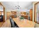 Dining room with a wooden table and chairs and access to the kitchen at 2471 Jenscot Rd, St Cloud, FL 34771