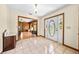 Foyer with tile floors, a decorative light fixture, and a view of a living room at 2471 Jenscot Rd, St Cloud, FL 34771