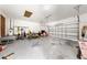 Spacious garage with ample storage and workspace, offering convenient parking and organization at 2471 Jenscot Rd, St Cloud, FL 34771