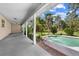 Inviting in-ground pool surrounded by lush landscaping and a spacious patio for outdoor enjoyment and relaxation at 2471 Jenscot Rd, St Cloud, FL 34771