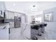 Elegant kitchen featuring stainless appliances, bar seating, and an open layout at 2503 Calla Lily Cv, Kissimmee, FL 34758