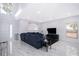 Inviting living room with high ceilings, featuring a comfortable sofa, sleek furnishings, and abundant natural light at 2503 Calla Lily Cv, Kissimmee, FL 34758