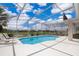 Relaxing screened-in pool with lounge chairs perfect for enjoying sunny days at 2503 Calla Lily Cv, Kissimmee, FL 34758
