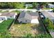 Aerial view of the house showing the backyard, fence, and surrounding neighborhood at 2629 Williston Dr, Lakeland, FL 33801