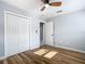 Cozy bedroom featuring a ceiling fan, closet, and natural light at 2629 Williston Dr, Lakeland, FL 33801