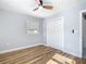 Bright bedroom featuring wood floors and a ceiling fan at 2629 Williston Dr, Lakeland, FL 33801