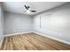 Light-filled bedroom features wood-look floors, a ceiling fan, and a built-in media center at 2629 Williston Dr, Lakeland, FL 33801