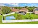 Aerial view showcasing a property with a pool, basketball court, and expansive backyard at 2722 Corybrooke Ln, Kissimmee, FL 34744