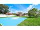 Backyard basketball court with lush greenery providing a recreational space at 2722 Corybrooke Ln, Kissimmee, FL 34744