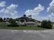 Remington Golf Club community sign amid lush landscaping and a beautiful sky at 2722 Corybrooke Ln, Kissimmee, FL 34744