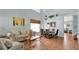 Bright living room featuring tile floors, high ceilings, and stylish furniture arrangement at 2722 Corybrooke Ln, Kissimmee, FL 34744