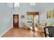 Inviting living room showcasing tile floors, high ceilings, and a decorative front door at 2722 Corybrooke Ln, Kissimmee, FL 34744