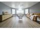 Inviting living room with a neutral color palette, lots of natural light, and a ceiling fan at 2735 N Poinciana Blvd # 95, Kissimmee, FL 34746