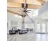 Inviting living room features wood beams, vaulted ceilings, and a modern seating arrangement at 2735 N Poinciana Blvd # 95, Kissimmee, FL 34746