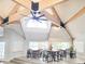 Shared meeting room showcases high ceilings with wood beams and ample seating for large groups at 2735 N Poinciana Blvd # 95, Kissimmee, FL 34746