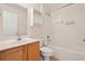 Well-lit bathroom with a combined shower and bathtub, featuring tiled walls and neutral decor at 3038 Elbib, St Cloud, FL 34769