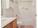 Bright bathroom features a tub and shower combination and classic vanity with storage at 3038 Elbib, St Cloud, FL 34769