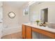 Bright bathroom featuring a tub, tiled floor, and modern vanity with ample storage space at 3038 Elbib, St Cloud, FL 34769