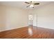 Spacious bedroom features hardwood floors and a ceiling fan for added comfort at 3038 Elbib, St Cloud, FL 34769