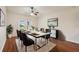 Bright dining room with modern table set, stylish decor, and sliding doors to the outside at 3038 Elbib, St Cloud, FL 34769