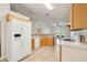 Eat-in kitchen features tile floors, backsplash, and a view to living area at 3038 Elbib, St Cloud, FL 34769
