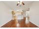 Open-concept living area featuring hardwood floors and view to kitchen at 3038 Elbib, St Cloud, FL 34769